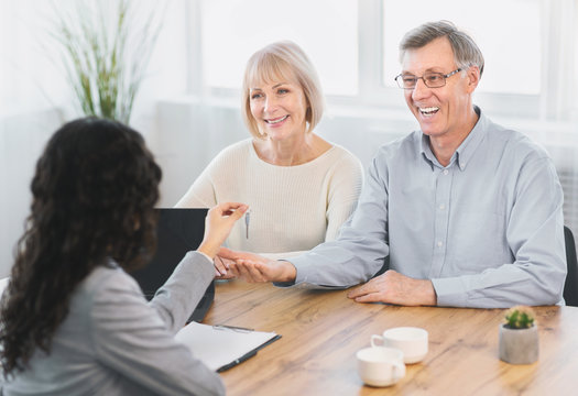 Happy Elderly Couple Getting New House Key