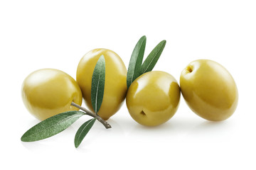 Four big green olives with olive leaves, isolated on white background