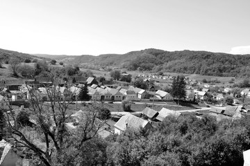 Typical rural landscape and peasant houses in  the village Alma Vii (Almen) Transylvania, Romania....