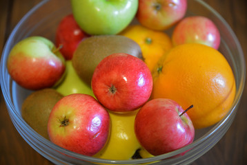 organic fruits in glass bowl