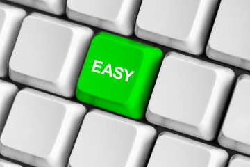 Green "easy" button on the white computer keyboard.