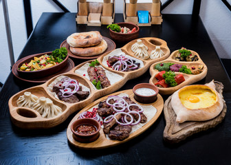 Georgian cuisine food set. Khachapuri, dolma, satsivi, khinkali, pkhali. 