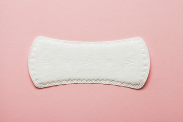 menstruation cycle, feminine hygiene and protection, sanitary pad on pastel pink background, top view, flat layout