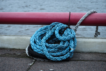 Fototapeta premium Blue strong shipping boat rope for big ship docking.