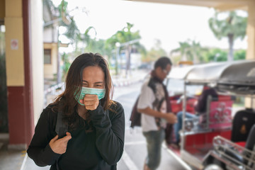 Fototapeta premium Asian traveler woman wear mask for protect coronavirus,Thai woman wearing face mask respiratory protect and filter pm2.5 (particulate matter)