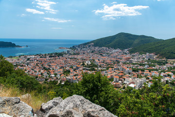 Fototapeta na wymiar Top View Of The Town Of Budva With High Mountains. Montenegro