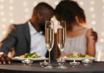 Two glasses of champagne on valentine dinner table