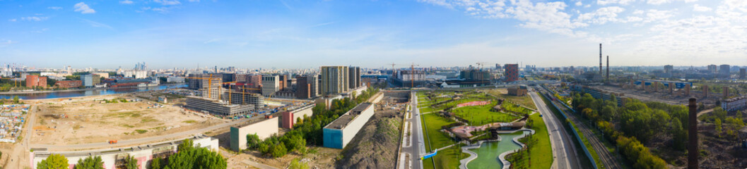 Scenic panoramic aerial view of the park and the construction of a new district in Moscow, Russia. ZILART in the south of Moscow. Landscape from a drone.