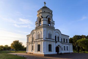 Fototapeta na wymiar Saint Nicholas Garrison church in Brest fortress against the sunset in summer, Belarus