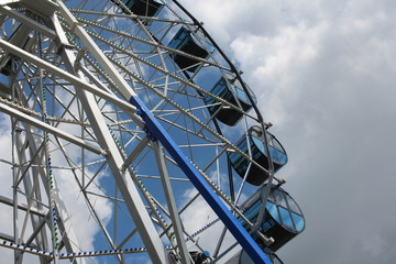 amusement ride a large Ferris wheel in the Park against the sky