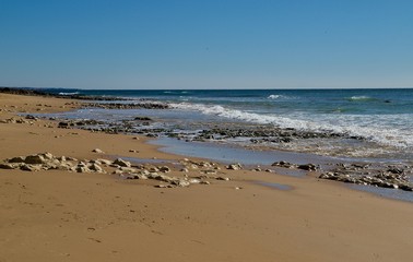 Fototapeta na wymiar Beautiful beach Praia da Oura in Albufeira at the blue Atlantic ocean
