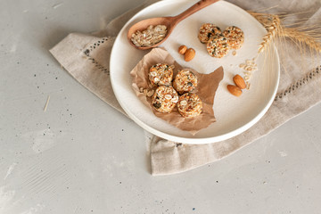 Raw vegan healthy dessert, date and nuts bliss balls, ingredients. Top view, space for text.