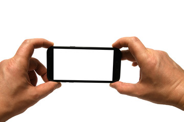 Hands holding mobile smart phone with blank screen. Isolated white background and clipping path.