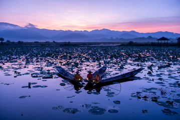 Intha Burmese fishermen on boat catching fish traditional at Inle Lake, Shan State, Myanmar