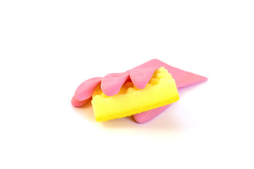 Pink rubber glove holding yellow domestic sponge isolated on a white background. Cleaning service concept.