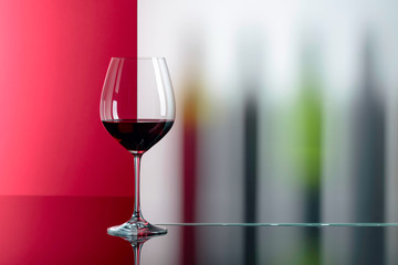 Red wine on a black table.