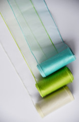 Reels organza ribbon pastel colors white blue green isolated white background. Vertical Design...