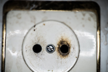 Burnt outlet at home close-up