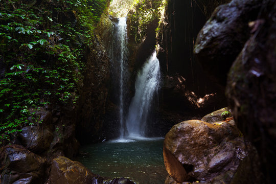 The Gitgit waterfall on the island of Bali. Waterfall in the tropical forest. Long exposure. Jungle river. Adventure in Asia, Indonesia