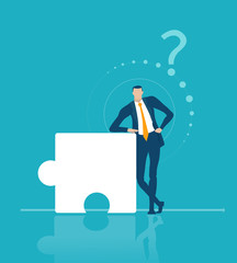 Successful businessman staying next to puzzle pies symbolising professional help, solving the problem and advisory concept