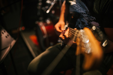 Playing guitar, close-up, copy space.
