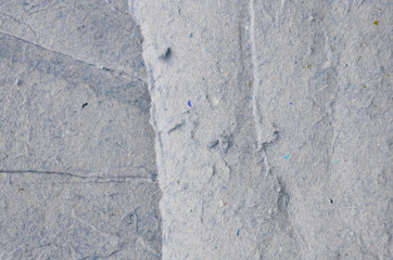 Creative background with scattered overlay of crumpled papers.