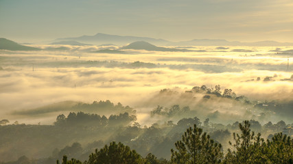 nice day in Da Lat, on the top of mountain view down of city in fog, sun light and rays