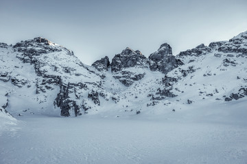 Beautiful winter landscape with snow covered mountain peaks