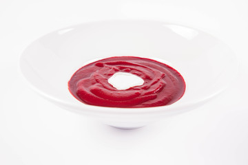 Beetroot cream soup decorated with yoghurt