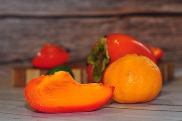 Orange juicy fruit and green feijua.