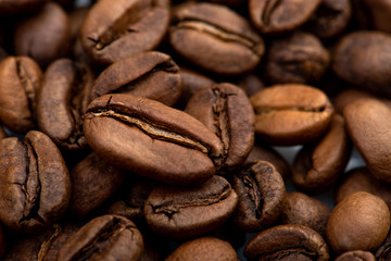 Coffee beans close-up background. Fresh roasted
