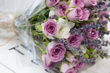 Composition of flowers delicate pink roses and white lilies