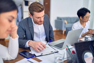 Group of business workers working together at the office