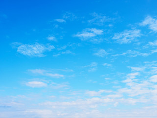Naklejka na ściany i meble White clouds on a blue sky background