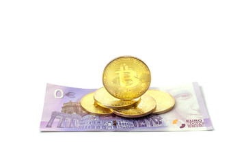 Coin bitcoin lies with european euro banknotes. Banknotes zero euro on an isolated white...