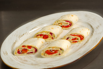 Rolls with fish with herbs on a plate