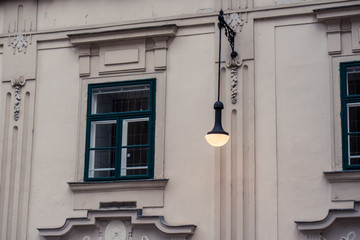 Cityscape of old window with a lamp