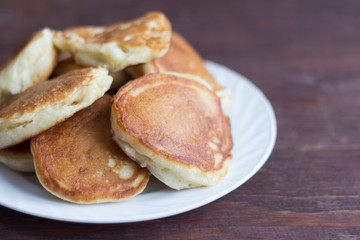 Lush homemade pancakes for Breakfast on the table.