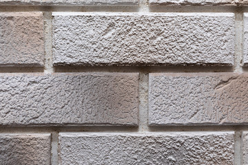 close-up of a light gray brick wall