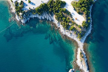 Aerial drone view of a remote rocky peninsula in Greece.
