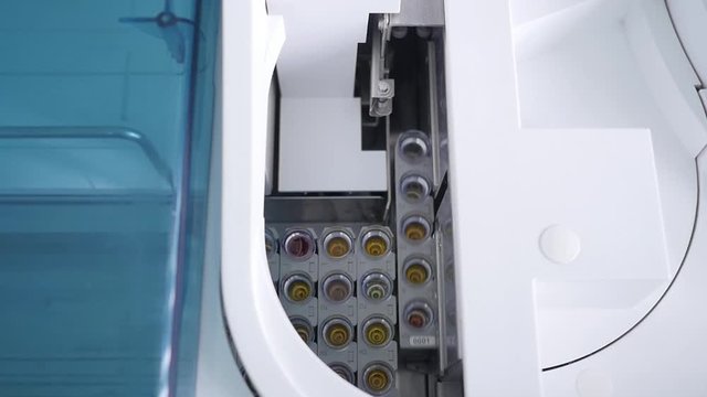 robotic medicine equipment for blood and urine analysis with a long pintle in a medical laboratory