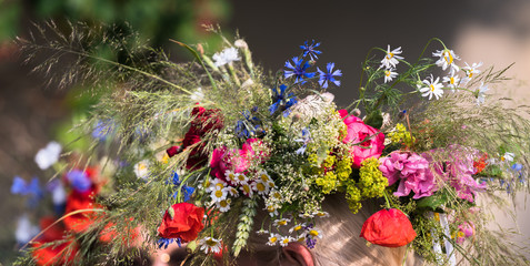 summer solstice wreath on head, handmade, individual parts in focus, summer day