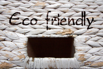 White wicker basket  texture (background) with a window and label “Eco friendly”