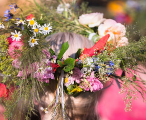 summer solstice wreath on head, handmade, individual parts in focus, summer day