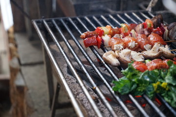 barbecue with meat and vegetables on grill
