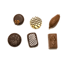 Studio shot wide selection of chocolate pralines isolated on white top view