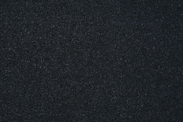 Obraz premium Glitter black background. Abstract bokeh texture of the starry sky.