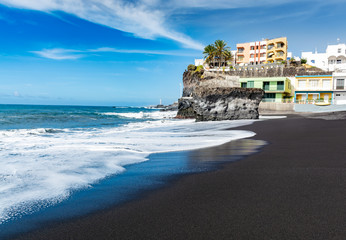 Black lava sand beach in Puerto Naos, La Palma, Canarian islands, Spain