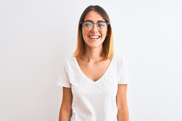 Beautiful redhead woman wearing glasses over isolated background with a happy and cool smile on face. Lucky person.