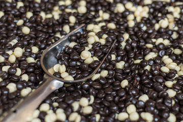 Assorted rainbow sweet icing sugar candies. Top view. Jelly sweets chocolate candies in scoop